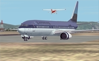 A European Airlines plane on the right ease-way in Mikonos (LGMK), Greece with a GA plane taking off