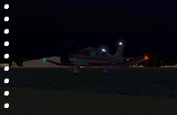 a GA plane with its light at night!
