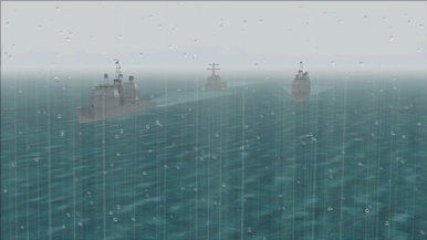Military ships amidst a tropical storm in the Malacca Strait